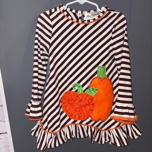 Striped Brown and White Dress with Orange Pumpkin Design
